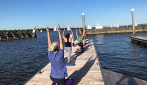 Yoga poses on the floating barge at Havre de Grace Marine Center with Yoga Studio 723